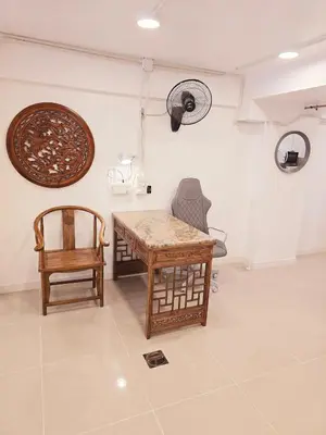 a room with a table and two chairs and a fan at Crane nest 1 Easy-peasy no stairs in Bangkok