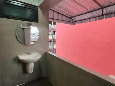 a bathroom with a sink and a mirror at Apartment near Khlong Bang Luang in Bangkok
