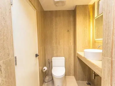 a bathroom with a toilet and a sink at Studio room with private garden in Center Sathorn in Bangkok