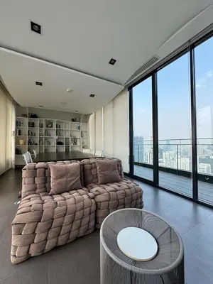 a living room with a large couch and a table at Downtown Luxury Apartment, Asok Cowboy Lane, 400m from BTS in Bangkok
