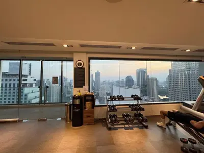 a gym with a view of a city skyline at Downtown Luxury Apartment, Asok Cowboy Lane, 400m from BTS in Bangkok
