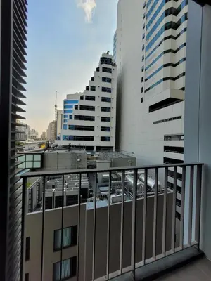 a view of a city from a balcony with buildings at Downtown Luxury Apartment, Asok Cowboy Lane, 400m from BTS in Bangkok