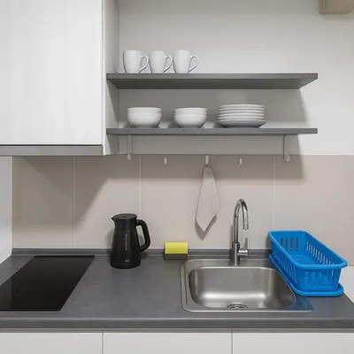 a kitchen counter with a sink and dishes on a shelf at 1 Bedroom Bangkok Skyline View Apartment At ON-NUT in Bangkok