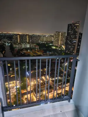 a view of a city at night from a balcony at 1 Bedroom Bangkok Skyline View Apartment At ON-NUT in Bangkok