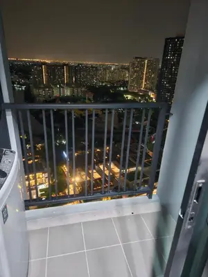a view of a city at night from a balcony at 1 Bedroom Bangkok Skyline View Apartment At ON-NUT in Bangkok