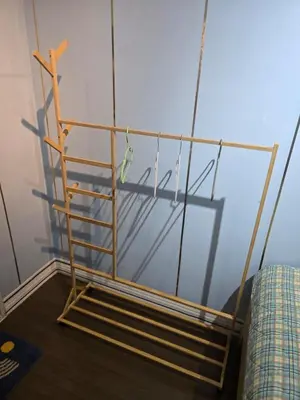 a wooden towel rack on the wall of a room at 100 Luxury Studio Apartment with private balcony in Bangkok