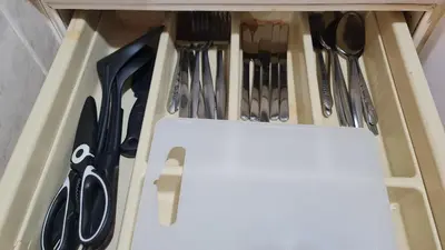 a drawer filled with knives and utensils at Comfort 1BR 2 King Beds, Best Value Stay, near Bts Nana in Bangkok