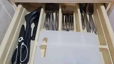 a drawer filled with knives and utensils at Comfort 1BR 2 King Beds, Best Value Stay, near Bts Nana in Bangkok