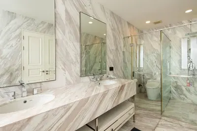 a bathroom with two sinks and a glass shower at Modern Luxury Poolhaus with Lift in Khlong Toei
