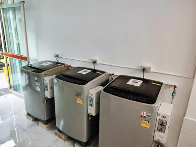 three trash cans lined up against a wall at Tropical Apartments 1 No Stairs easy peasy in Bangkok
