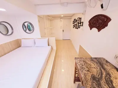 a room with a white couch and a table at Crane nest 2 mezzanine opaque view in Bangkok