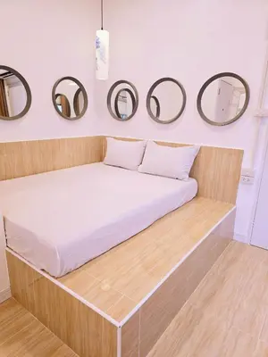 a bed in a room with mirrors on the wall at Crane nest 6 Townhouse View in Bangkok