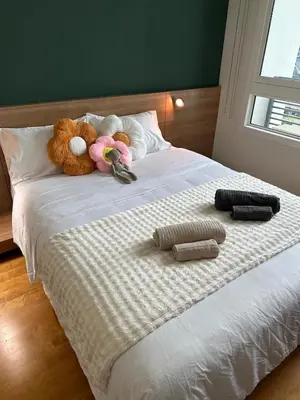 two stuffed animals sitting on top of a bed at New 5 STARS suite l 4 mins walk BTS&APL in Bangkok