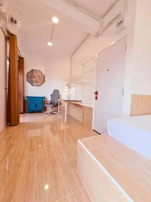 a bedroom with a bed and a desk in a room at Crane nest 9 palm tree villa view in Bangkok