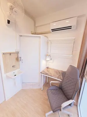 a small room with a desk and a chair at Crane nest 10 banana farm view in Bangkok