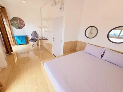 a bedroom with a white bed and a mirror at Crane nest 12 mansion view in Bangkok
