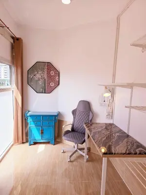 a room with a desk and a chair and a mirror at Crane nest 12 mansion view in Bangkok