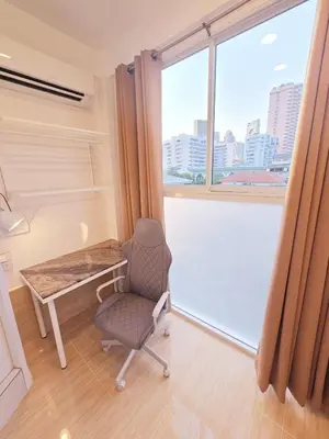 a room with a desk and a chair and a window at Crane nest 13 Bangkok downtown view in Bangkok