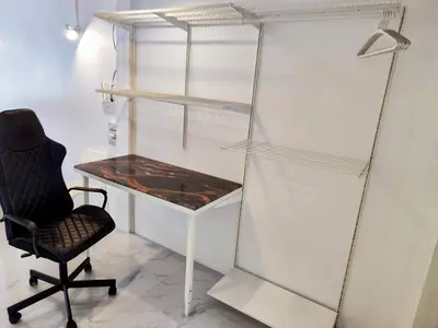 a desk and a chair in a room at Tropical Apartments 8 Explore Bangkok MRT Lumpini in Bangkok
