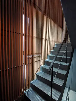 a staircase in a building with wooden walls at Japanese Style 1-Bedroom 162m BTS Thonglor-Ekmai \u7af9 \u30ec\u30b8\u30c7\u30f3\u30b9 in Bangkok
