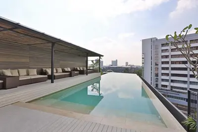 a swimming pool on the roof of a building at Japanese Style 1-Bedroom 162m BTS Thonglor-Ekmai \u7af9 \u30ec\u30b8\u30c7\u30f3\u30b9 in Bangkok