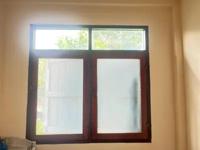 a window in a room with white curtains at 212 Cozy room with private balcony in Bangkok