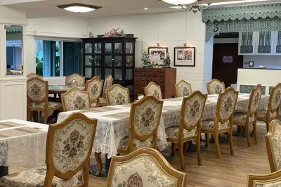 a dining room with a table and chairs at Suan Sunandha Palace Hotel in Bangkok