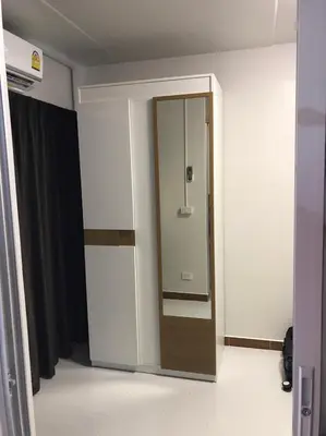 a bathroom with a glass door in a room at Muangthongthani Rental/Khun Dan in Nonthaburi