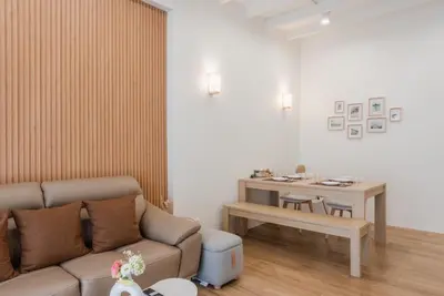 a living room with a couch and a table at The Urban478 Modern&Cozy Stay in Bangkok
