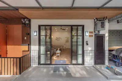 an entrance to a house with a glass door at The Urban478 Modern&Cozy Stay in Bangkok