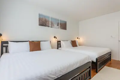 two beds sitting next to each other in a room at The Urban478 Modern&Cozy Stay in Bangkok
