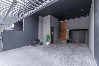 an empty lobby with a potted plant in a building at Heaven Thonglor 36 - Villa in Bangkok