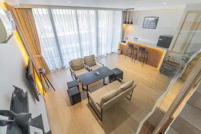 an overhead view of a living room with a table and chairs at Heaven Thonglor 36 - Villa in Bangkok