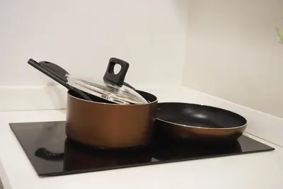 a pot sitting on top of a stove at Amazing Pool and Luxury Condo Unit Near Phrom Phong BTS in Bangkok