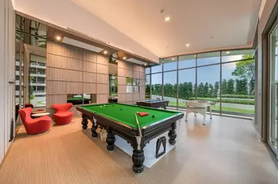 a billiard room with a pool table and some chairs at Amazing Pool and Luxury Condo Unit Near Phrom Phong BTS in Bangkok