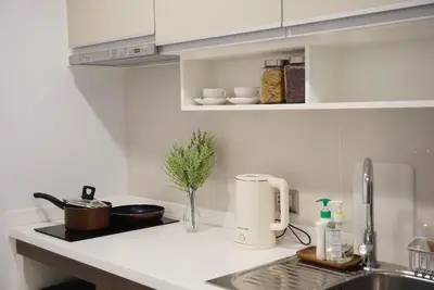 a kitchen with a sink and a counter top at Amazing Pool and Luxury Condo Unit Near Phrom Phong BTS in Bangkok