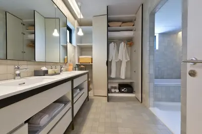 a bathroom with two sinks and a shower at Tree Villa Bangkok in Bangkok