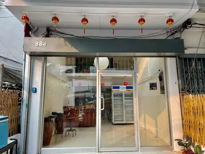 an entrance to a building with a glass door at Baan KhaoSoi - Rooftop House in Talad Noi in Samphanthawong