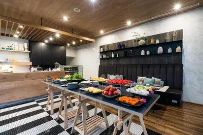 a table with fruits and vegetables on it in a kitchen at The Residence on Thonglor by UHG in Bangkok