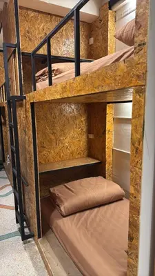 a couple of bunk beds in a room at Comfy Corner Hostel in Bangkok