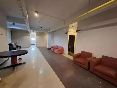 a large room with couches and a table in a building at XX The Hidden Khaosan - เดอะฮิดเด้นถนนข้าวสาร รามบุตรี in Bangkok