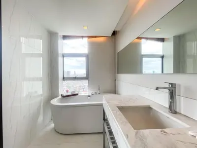 a white bathroom with a tub and a sink at Spacious City 118 SQM Fast WiFi BTS Chong Nonsi in Bangkok