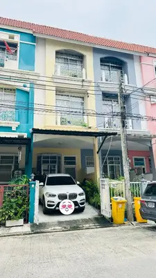 a white car parked in front of a building at Bangkok Halwa home in Sathani Ban Hua Mak