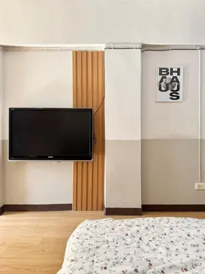 a room with a flat screen tv on a wall at Budget 1b1b Heart of Ramkamheng in Sathani Khlong Tan