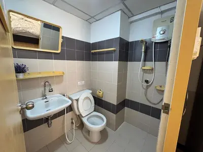 a bathroom with a toilet and a sink and a shower at Budget 1b1b Heart of Ramkamheng in Sathani Khlong Tan