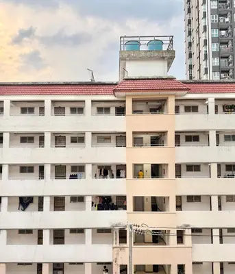 an apartment building with a tower on top of it at Budget 1b1b Heart of Ramkamheng in Sathani Khlong Tan