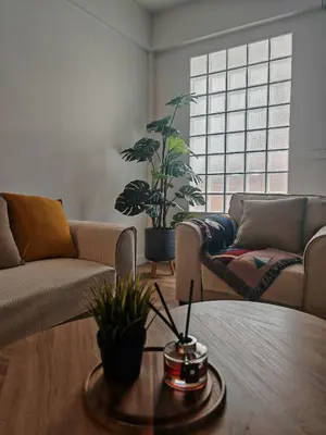 a living room with two couches and a table at Super cozy new townhome in central of Bangkok 4 PAX in Ban Chek
