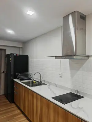 a kitchen with a sink and a refrigerator at Super cozy new townhome in central of Bangkok 4 PAX in Ban Chek