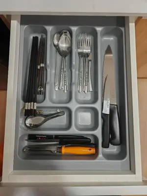 a tray filled with utensils in a drawer at Super cozy new townhome in central of Bangkok 4 PAX in Ban Chek