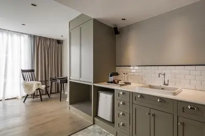 a kitchen with a sink and a counter at Hotel Once Bangkok in Bangkok